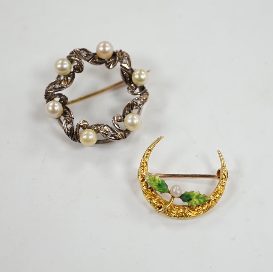 A yellow metal enamel and small baroque pearl set folate crescent brooch, 27mm, together with a yellow metal, cultured pearl and diamond chip set openwork circular brooch.